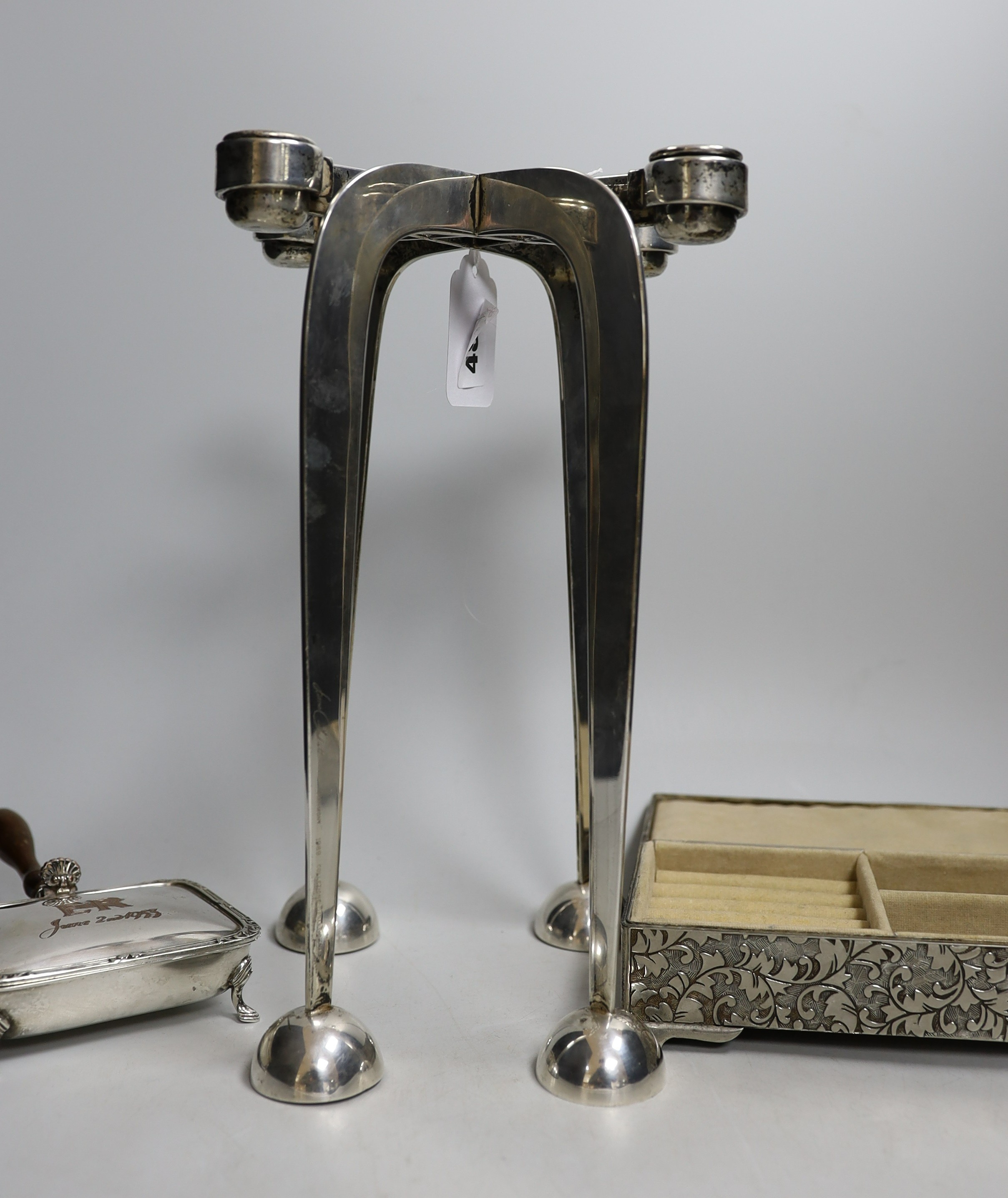 A silver-plated four sconce candelabrum, 28cms high and two other plated items